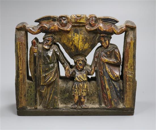 A Sicilian carved and painted wood religious group with Palermo retailers label, width 18cm, 15cm high